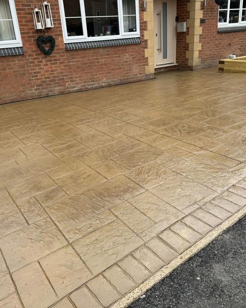 Buff ashlar pattern imprinted concrete driveway