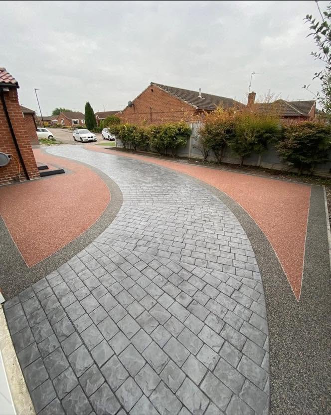 Two-tone resin & grey imprinted concrete bungalow driveway