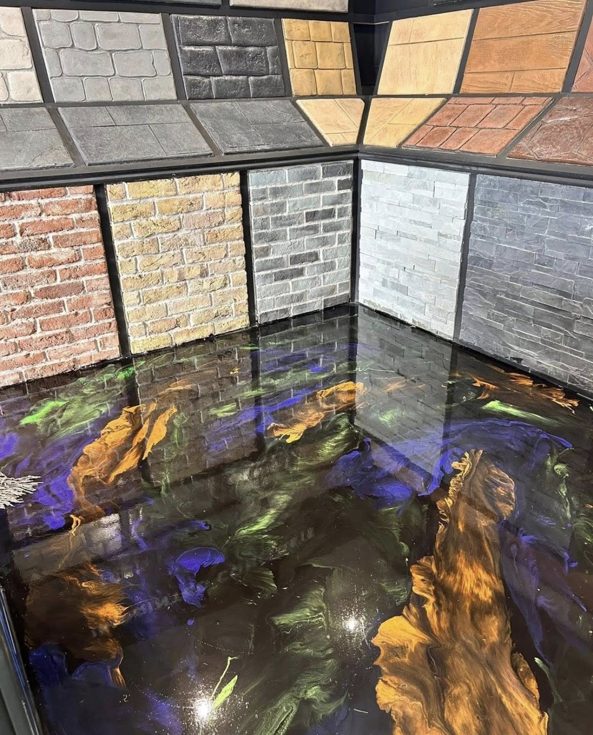 Imprinted concrete & brick samples over a metallic resin showroom floor