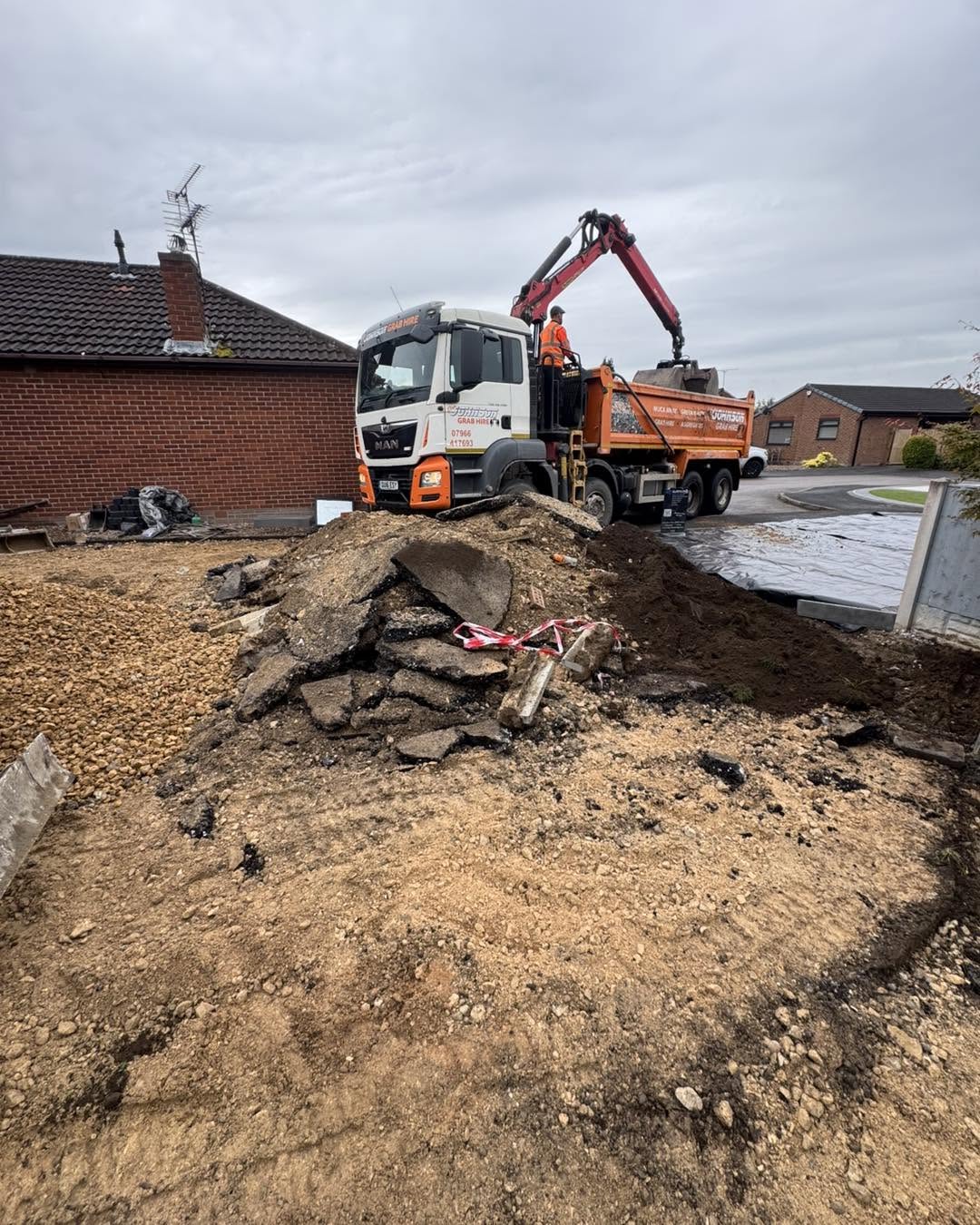 Driveway excavation & muck-away — groundworks in progress