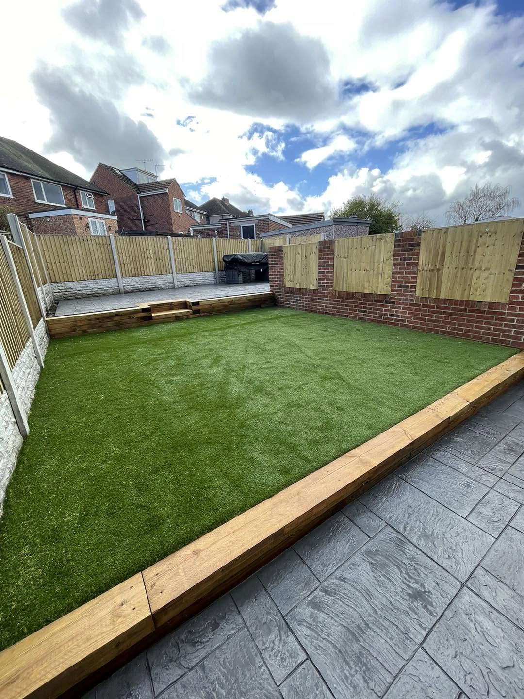 Artificial grass lawn with sleeper edging, patio & new fencing