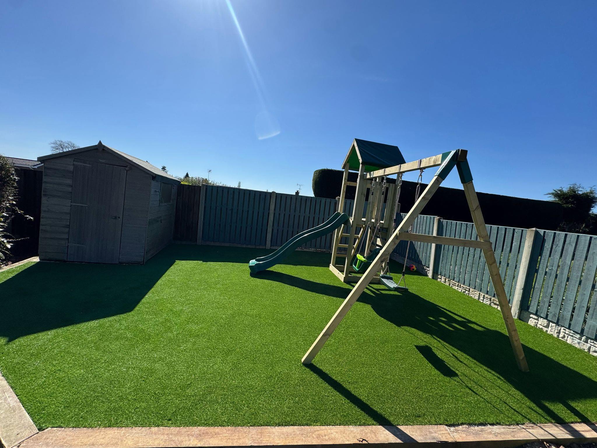 Family garden with artificial grass & play equipment