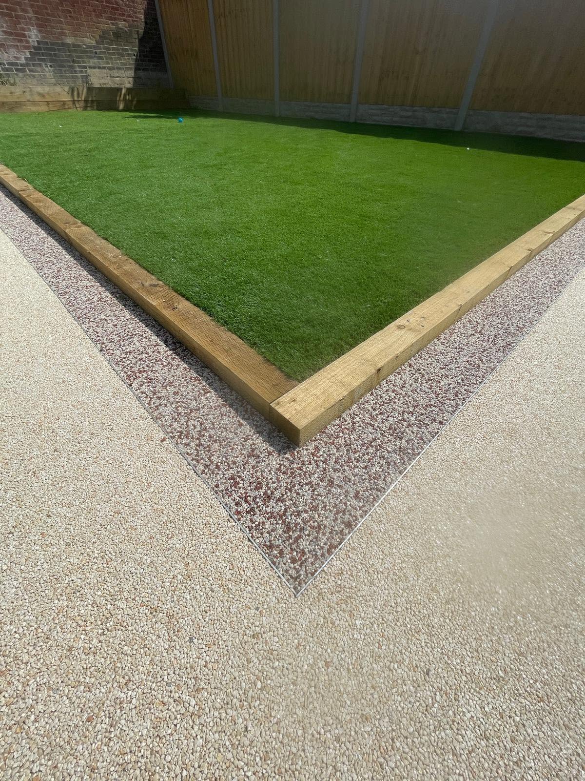 Resin-bound border with an inset artificial grass lawn