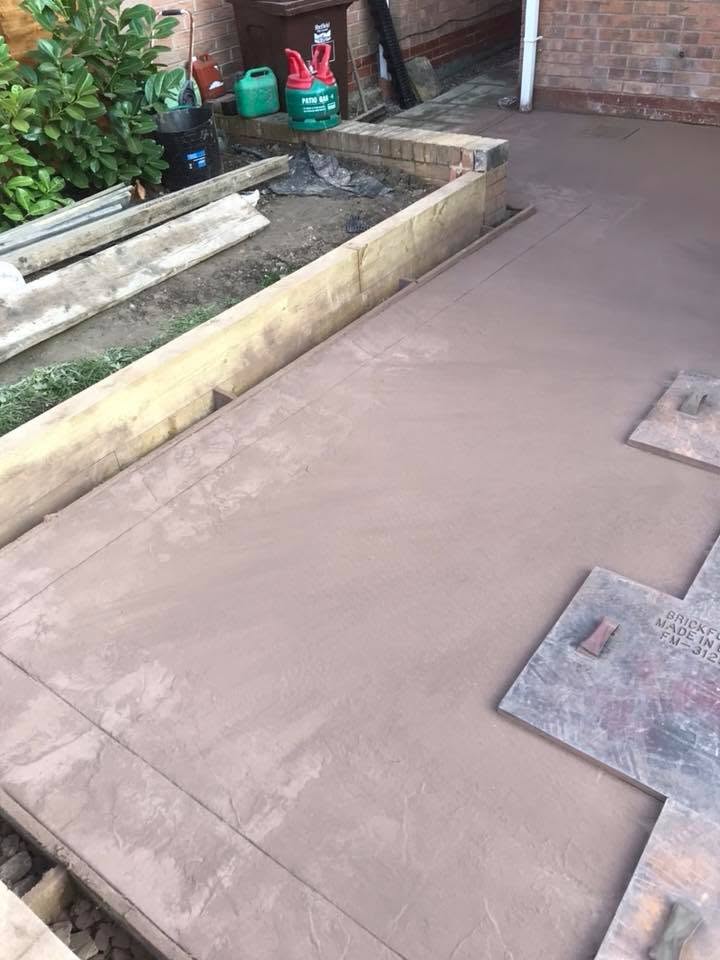 Freshly poured concrete ready for imprinting — work in progress