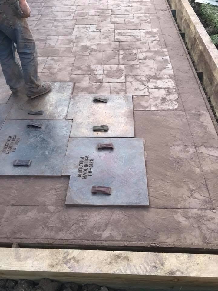 Stamping the pattern into fresh imprinted concrete