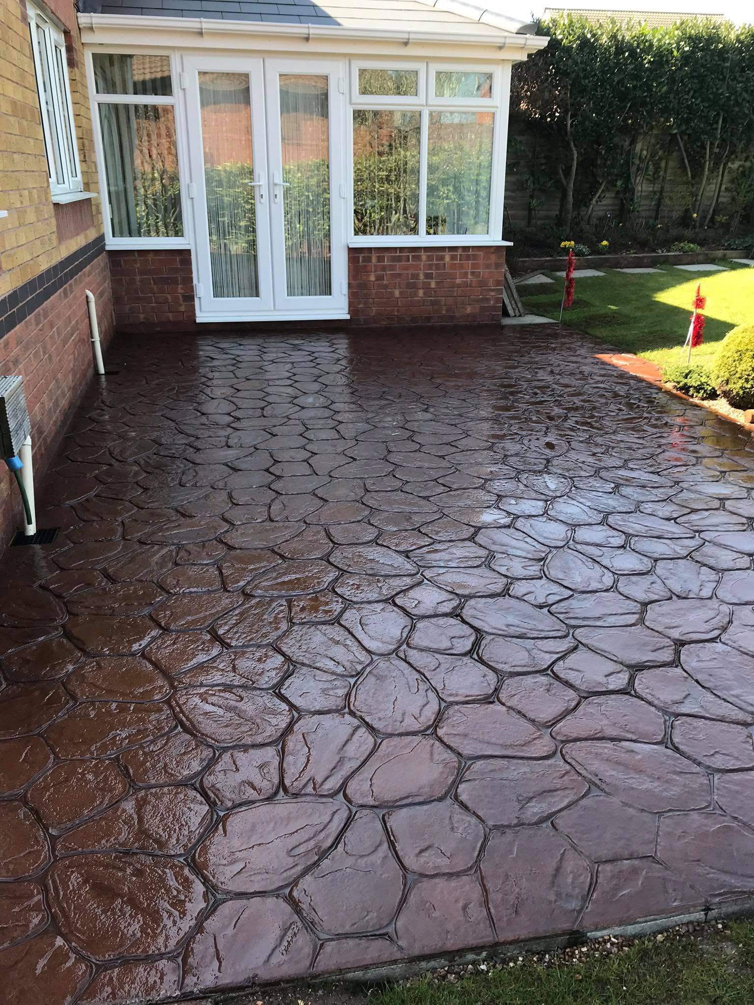 Terracotta random-stone imprinted concrete patio